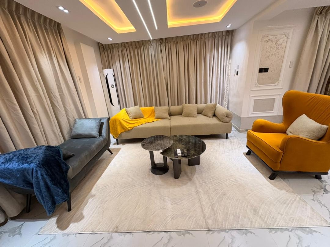 Project LS living room with sectional sofa and velvet accent chairs