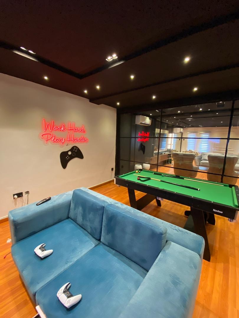 Project Sapphire neon signage and pool table
