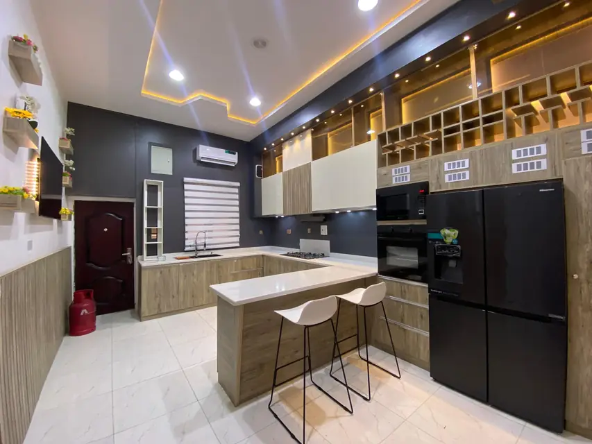 Modern kitchen with a breakfast bar and wood finish cabinets