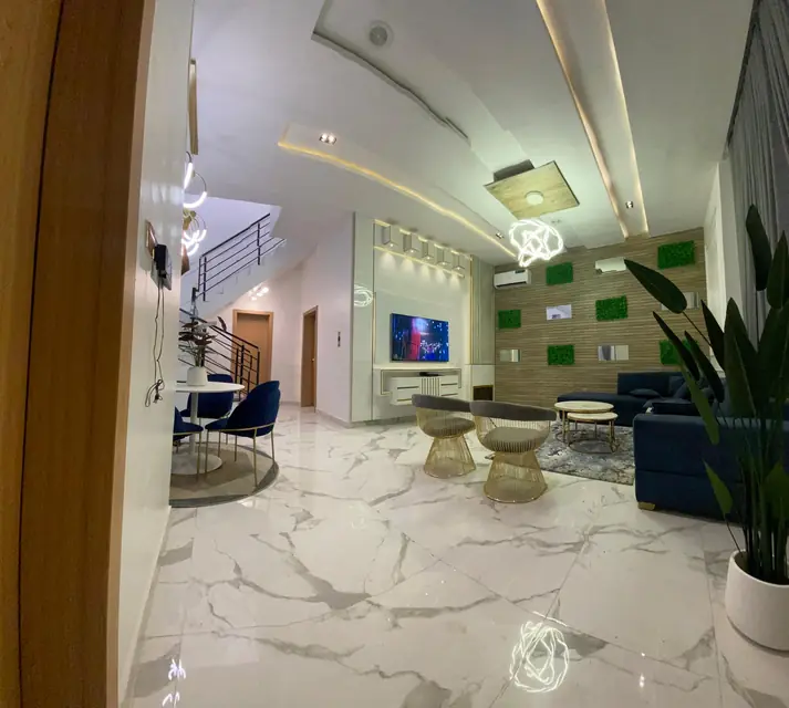 Entrance hallway with marble flooring and feature ceiling lighting